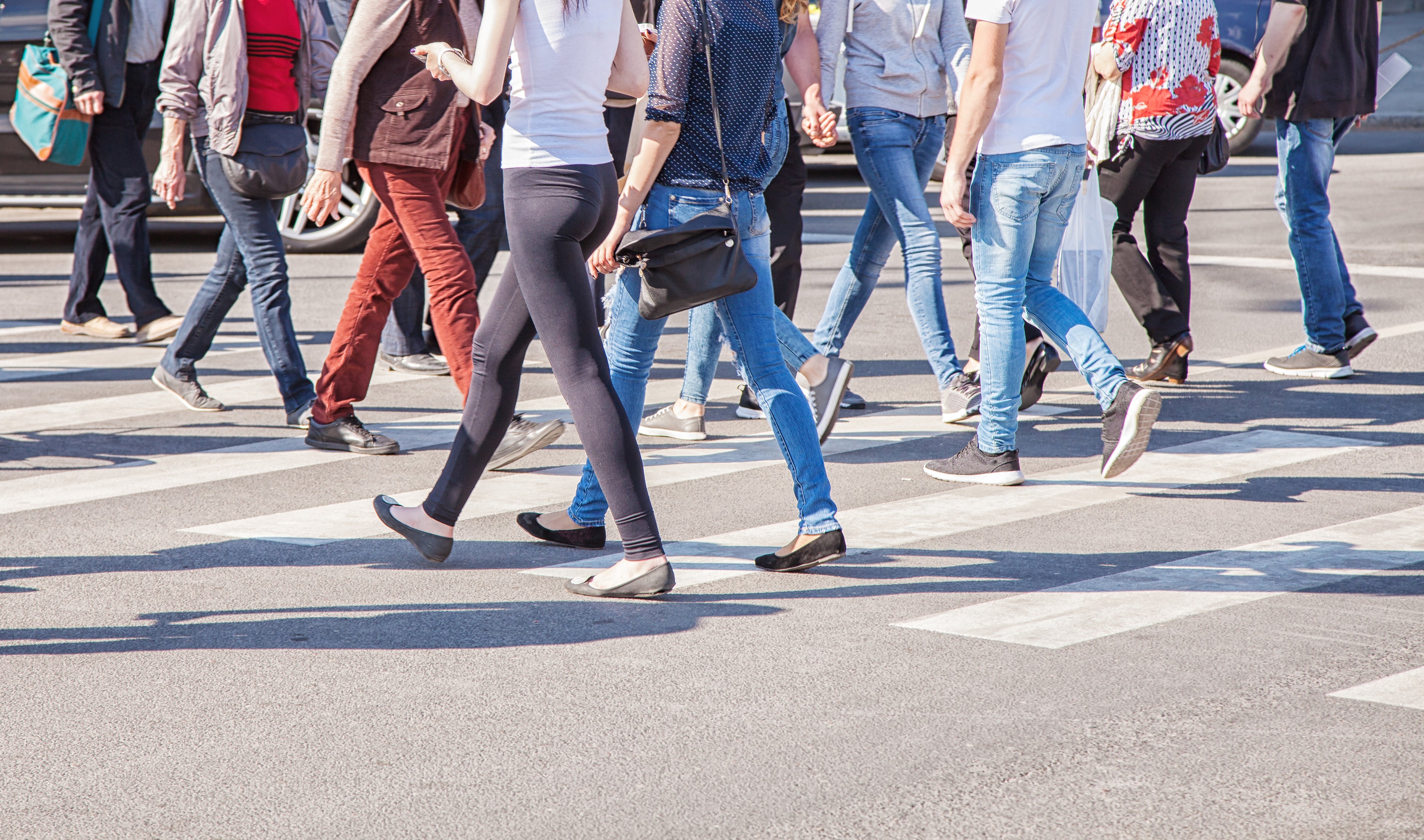 People crossing a street at a crosswalk